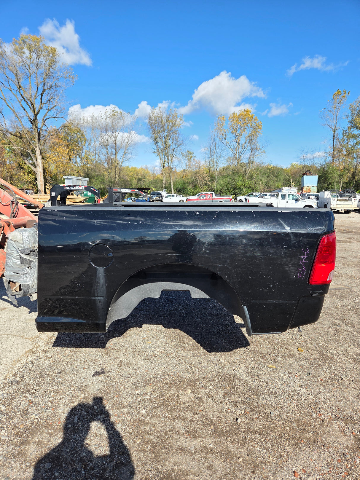 RAM dually pickup box in the yard, stock number 56446 marked on the bedside
